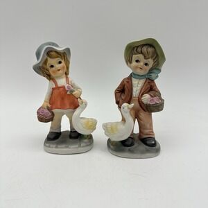 Vintage Porcelain Boy And Girl Figurines Each With A Duck & Basket Of Flowers 5"